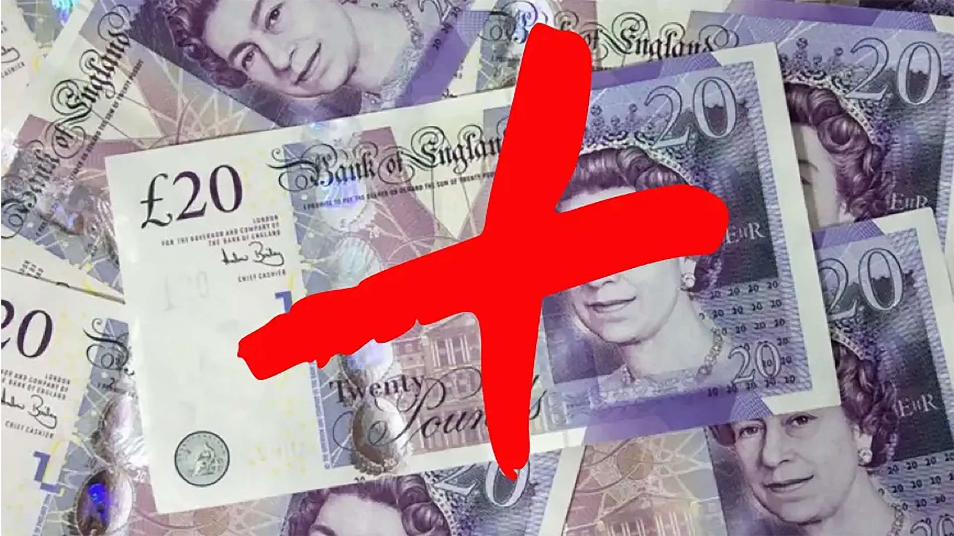 Picture of a pile of bank notes with a big graffiti red X stamped on top