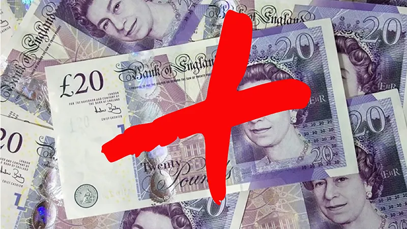 Picture of a pile of bank notes with a big graffiti red X stamped on top