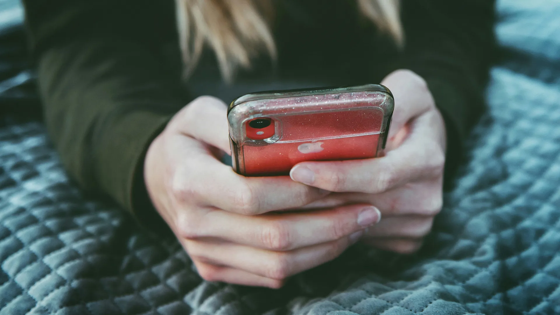 Close-up of person scrolling on a mobile phone